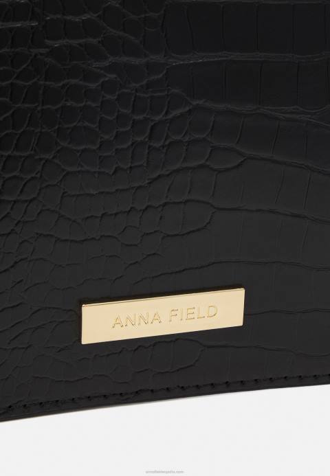 mujer bolso negro Anna Field 84Z82365